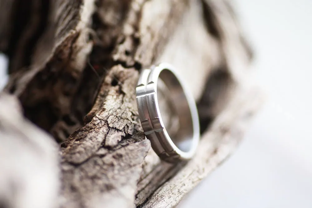 Solid gold or sterling silver wedding ring with simple lines