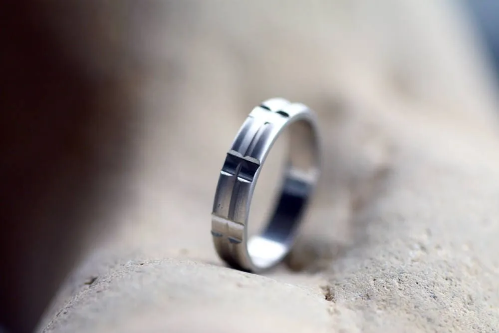 Solid gold or sterling silver wedding ring with simple lines
