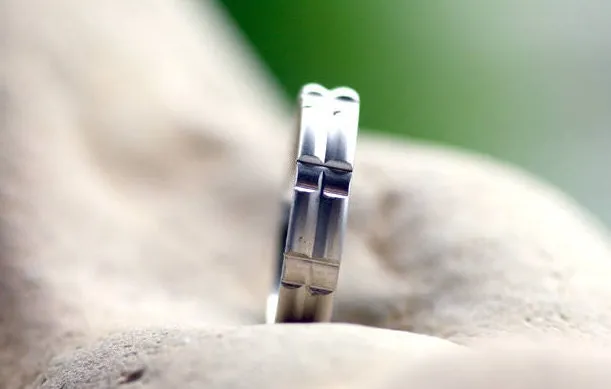 Solid gold or sterling silver wedding ring with simple lines